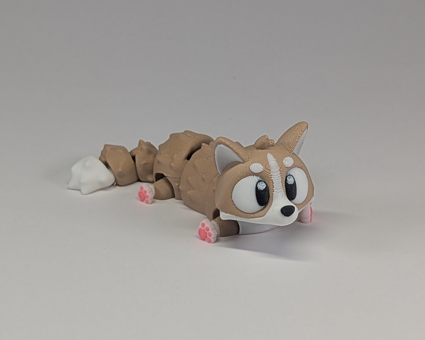 Corgi Cute Critter laying down right angled View