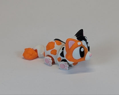 Calico Cat Cute Critter laying down facing right
