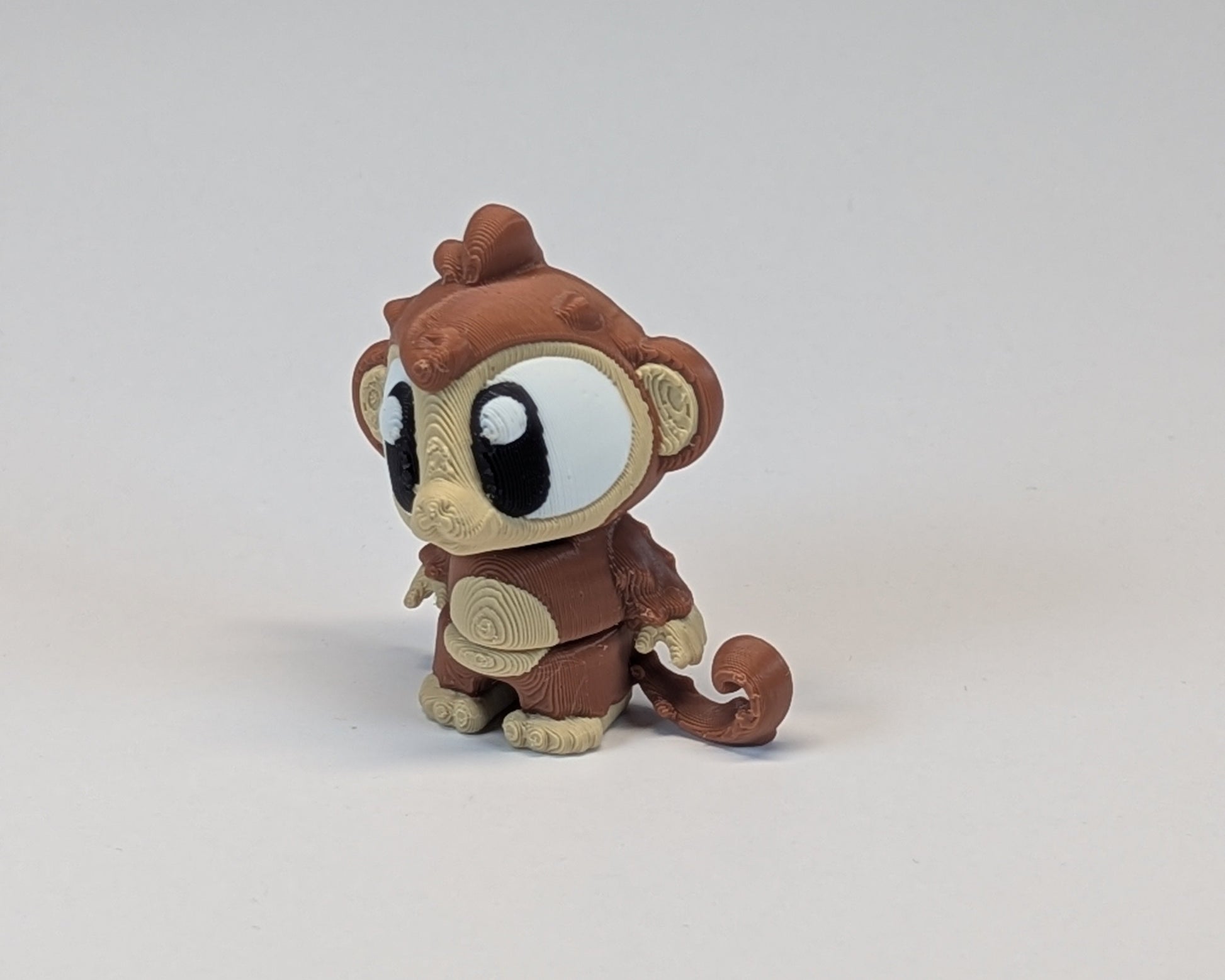 Single Cute Critter Monkey Standing Facing Right with Curly Tail