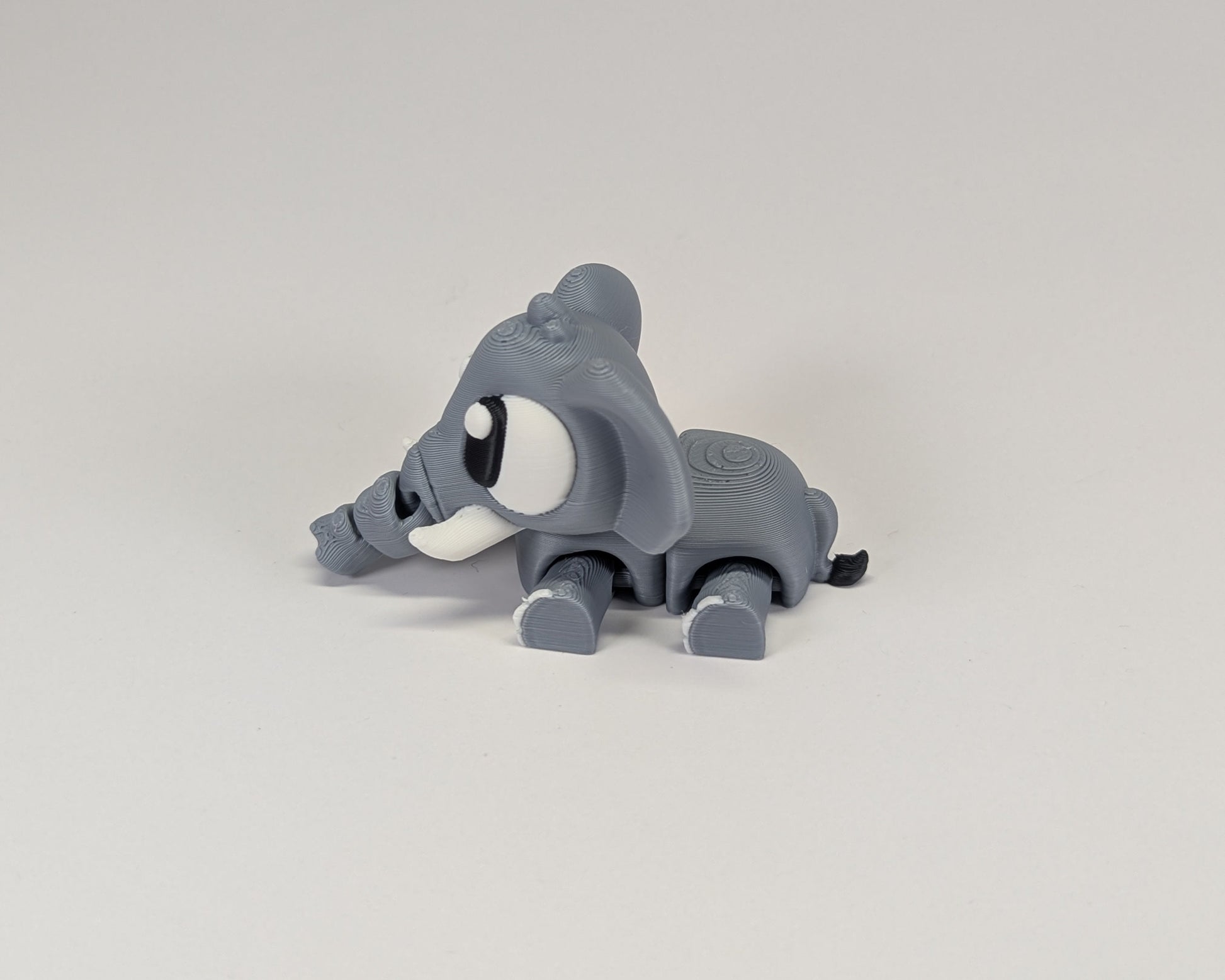 Elephant Cute Critter Laying Down Looking Left