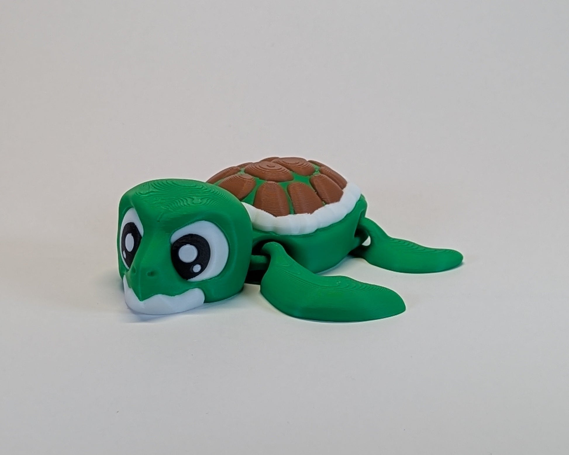 Plush turtle toy on a white background