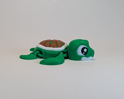 Green turtle plush toy on a white background