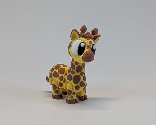 Giraffe Cute Critter Standing facing the camera with head turned