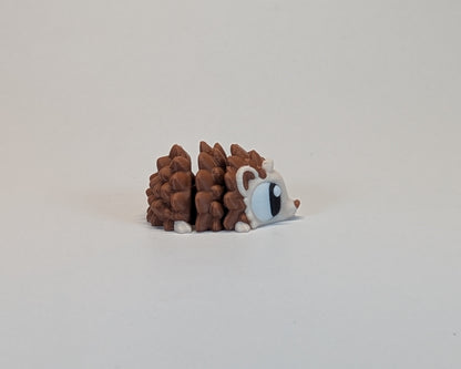 Small hedgehog cute critter on a light beige background looking right