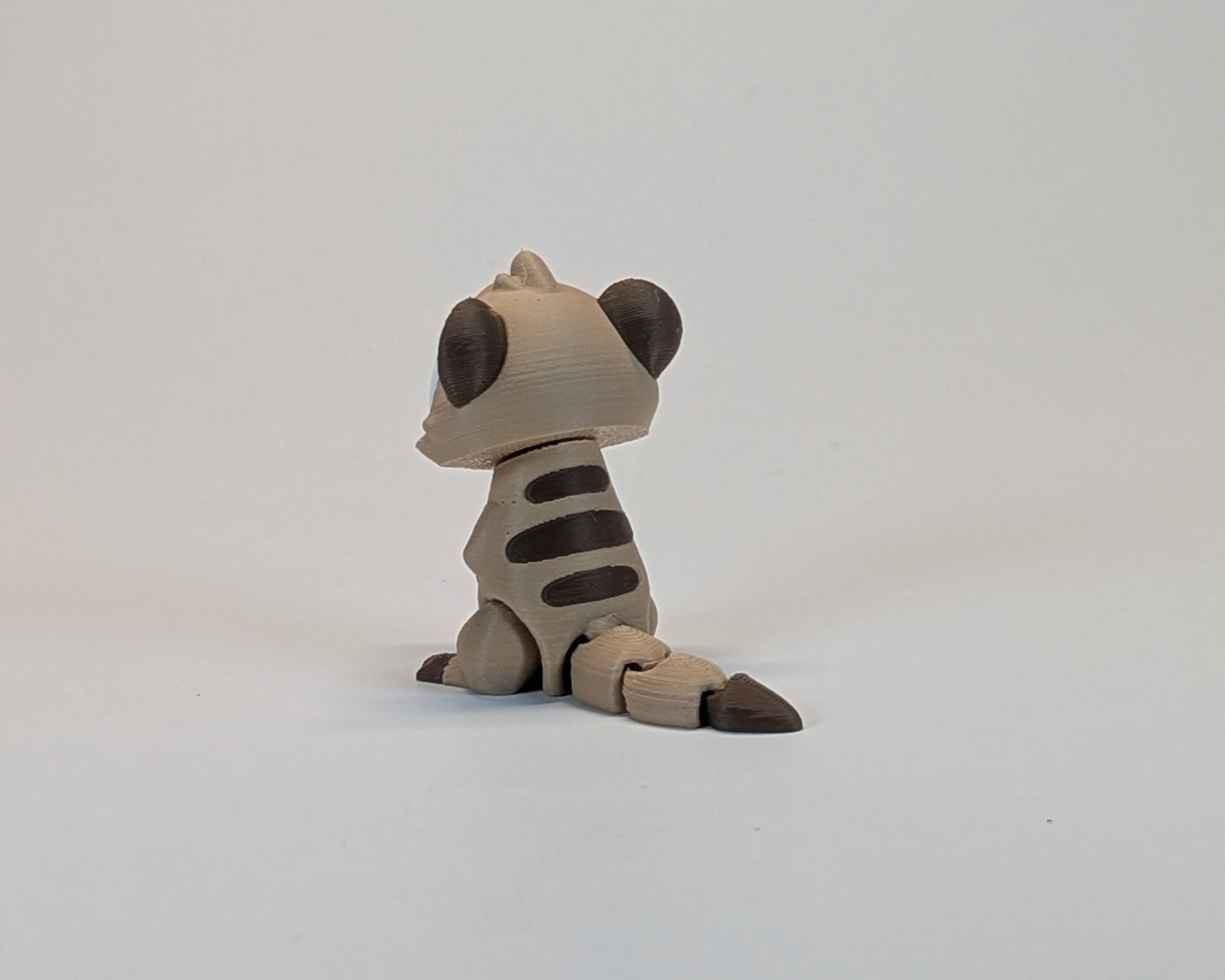 Meerkat Cute Critter back view showing its stripes