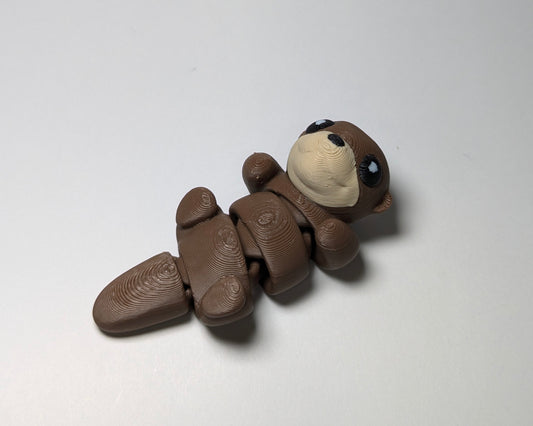 Otter Jiggle Pets Mini Flexi Animal on their back right facing